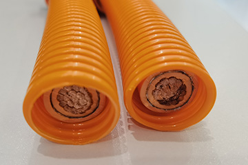 orange colored high voltage cable